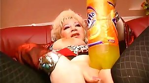 Granny masturbates with huge objects